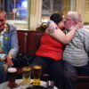 uk_great_britiain_wales_cardiff_pub_social_club_night_people_patrons_kiss_kissing_drinking_alcohol_beer_pint.jpg